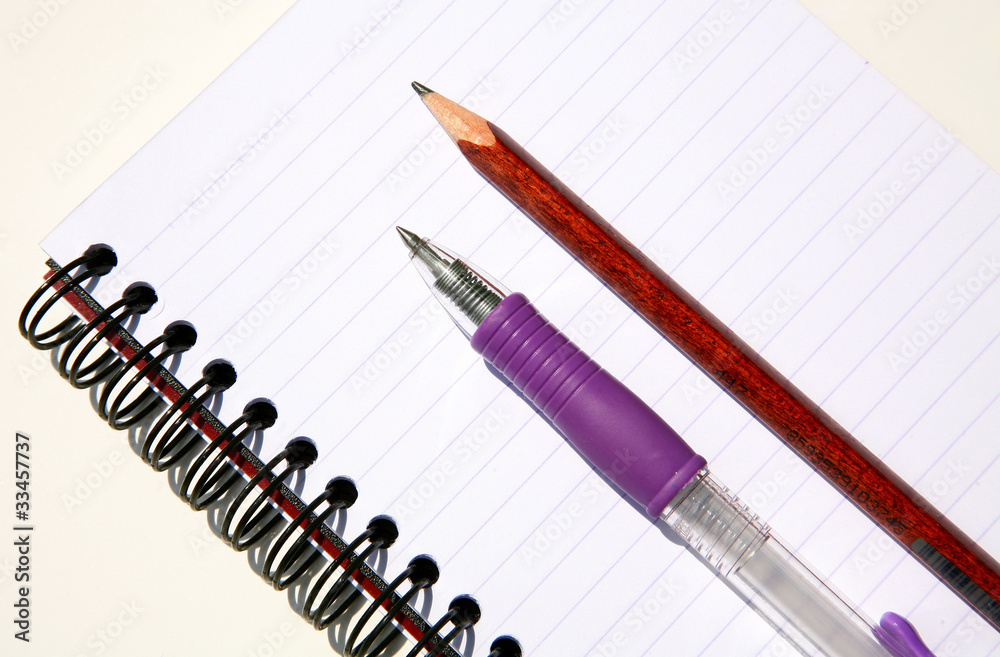 Paper notebook with pen and pencil on white background Paper notebook with pen and pencil on white background