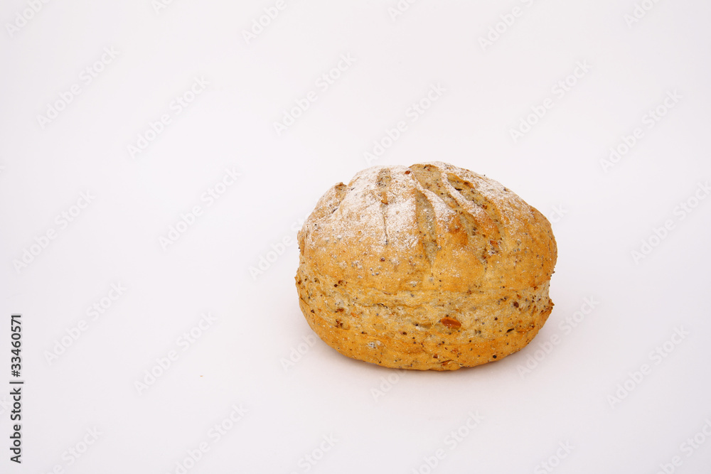 Newly baked appetizing whole meal multigrain bread on white back Newly baked appetizing whole meal multigrain bread on white back
