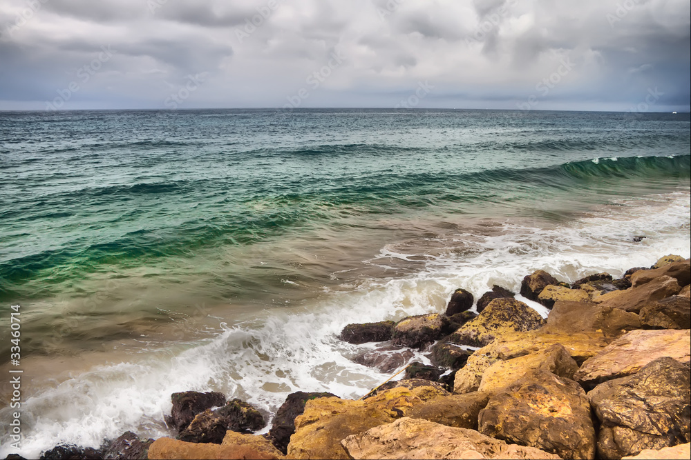 stones in surf waves.