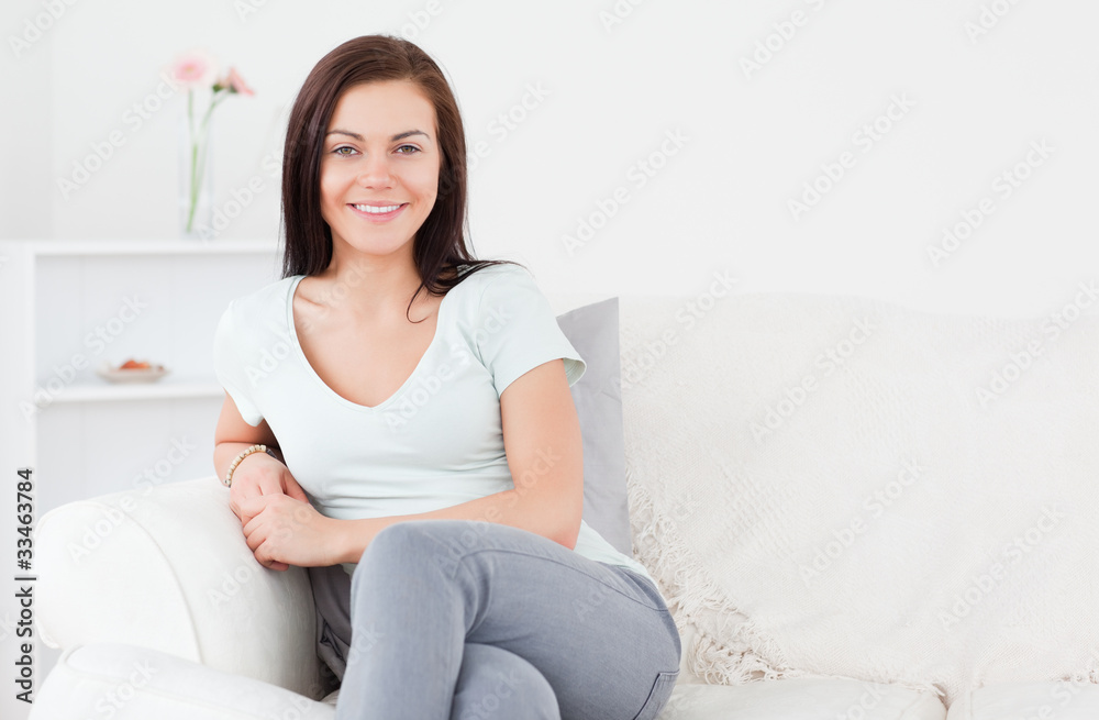 Young woman posing on the sofa Young woman posing on the sofa