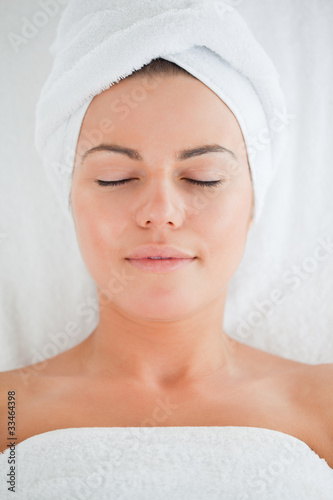 Portrait of a cute woman wearing a towel