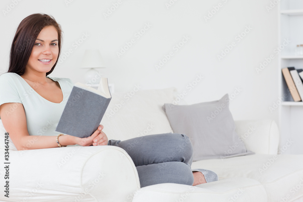 Sitting young brunette with a book Sitting young brunette with a book