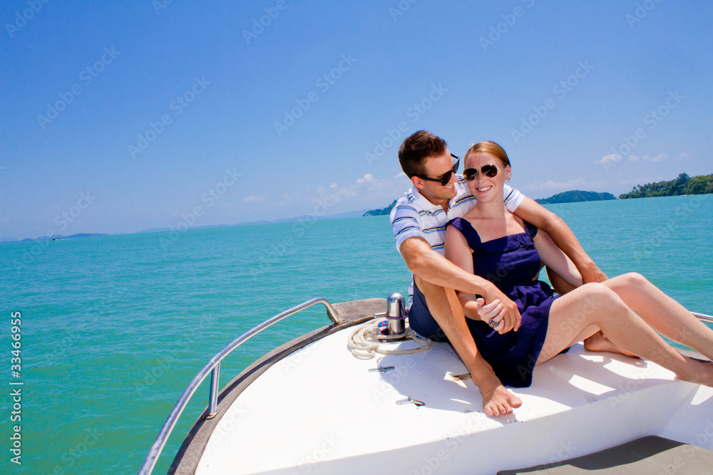 Fototapeta premium Couple Relaxing On A Boat