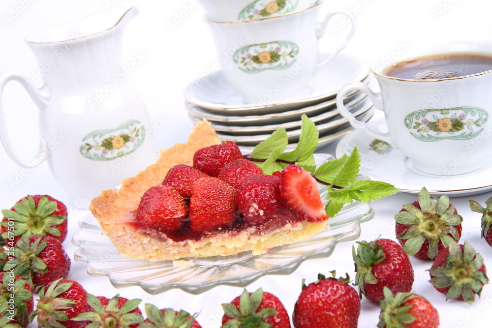Strawberry tart, mint twig and a cup of tea Strawberry tart, mint twig and a cup of tea