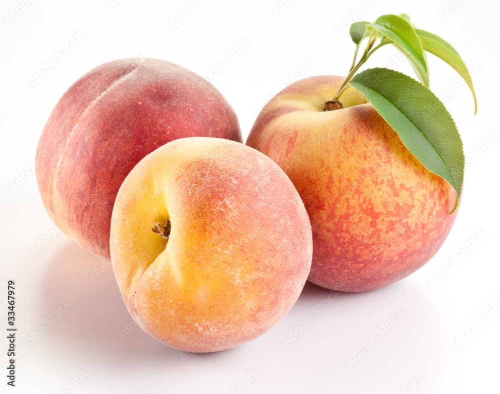 Three ripe peach with leaves Three ripe peach with leaves