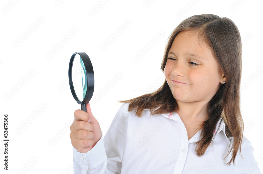 girl looking through a magnifying glass girl looking through a magnifying glass
