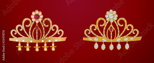 two gold diadems isolated on red