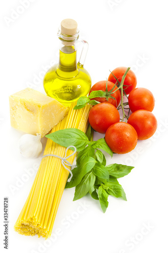 Ingredients for Italian cooking: olive oil, basil, tomato, parme