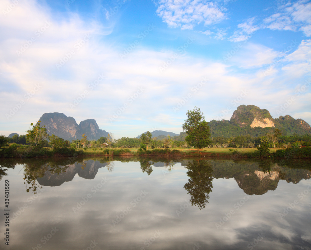 Rocks hills and mountains with reflection in the water. Krabi province of Thailand