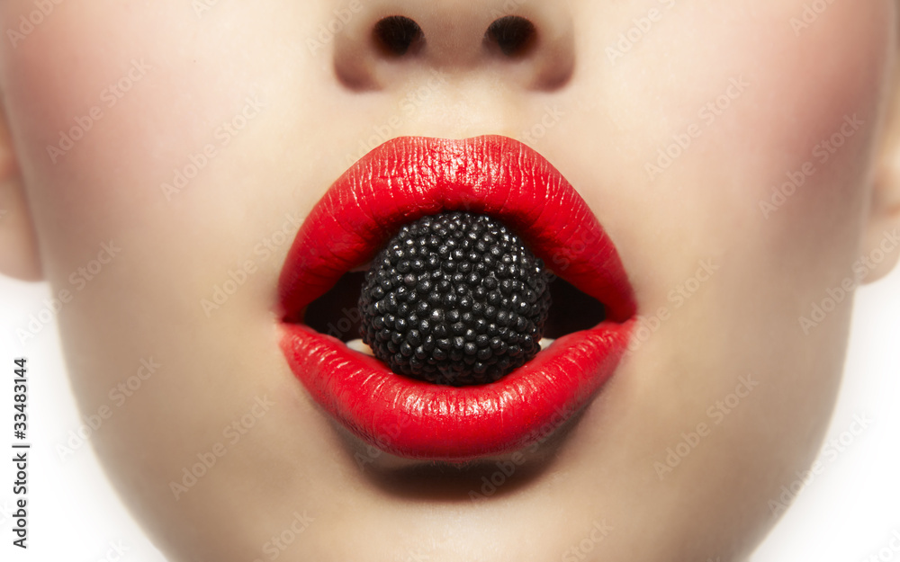 Fototapeta premium mouth bitting fruit