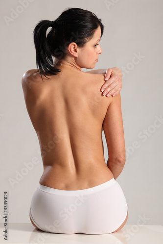 Shoulder back pain for semi naked young woman