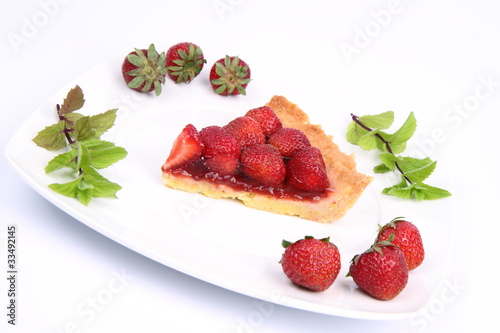 e of Strawberry Tart decorated with strawberries and mint