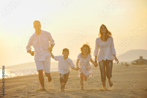 happy young family have fun on beach