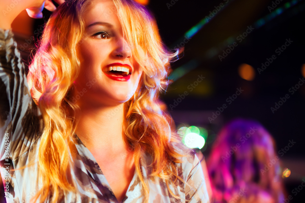 Woman in club or bar having fun (motion blur!) Woman in club or bar having fun (motion blur!)