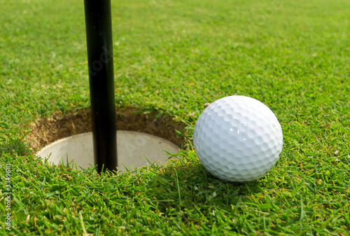 Golf ball just near the hole