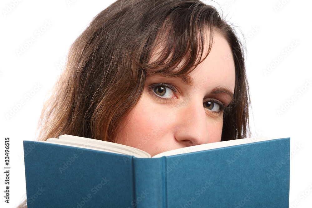 Young girls beautiful green eyes reading a book Young girls beautiful green eyes reading a book