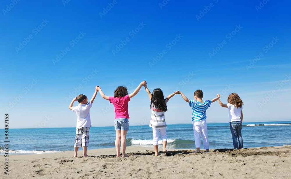 kids playing on beach kids playing on beach