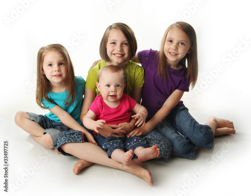 Four young adorable sisters