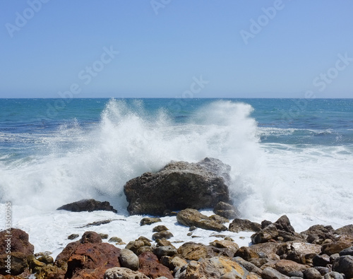 Crashing waves on a rock