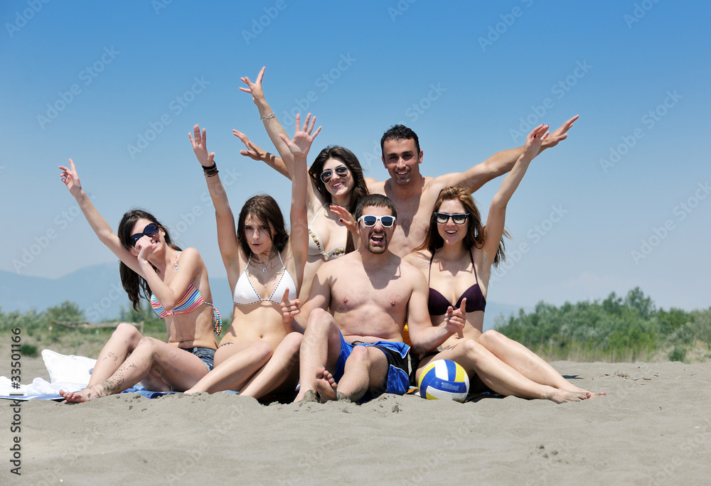happy young people group have fun on beach happy young people group have fun on beach
