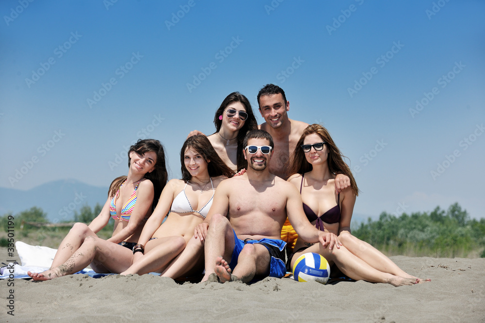 happy young people group have fun on beach happy young people group have fun on beach