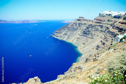 the rocky coastline of santorini island