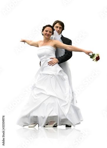 Dancing young wedding couple isolated on white background.