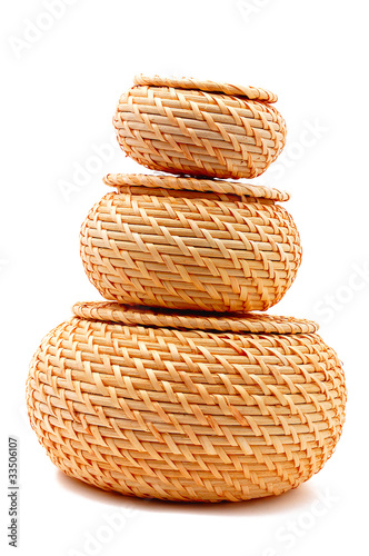 three wicker straw baskets