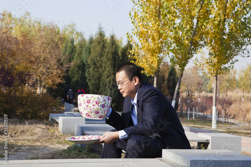 man with a huge coffee cup