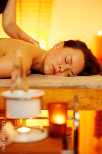 Woman relaxing in massage salon