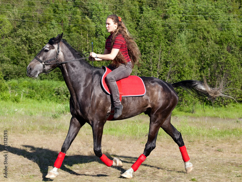 A girl riding a horse