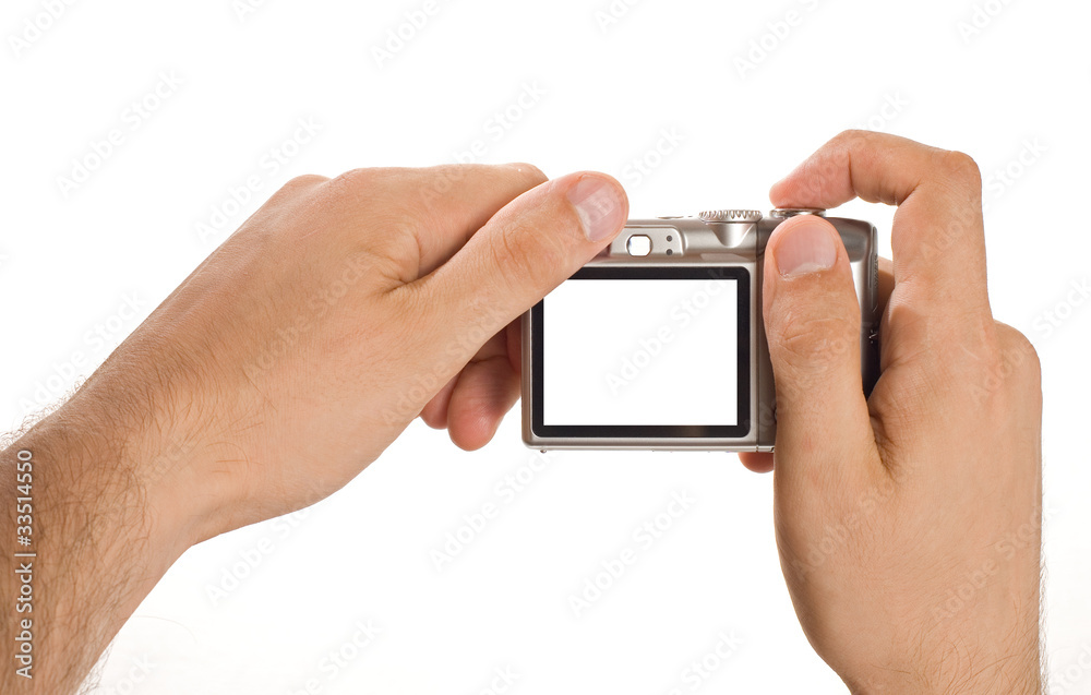 compact digital photo camera held in hands compact digital photo camera held in hands