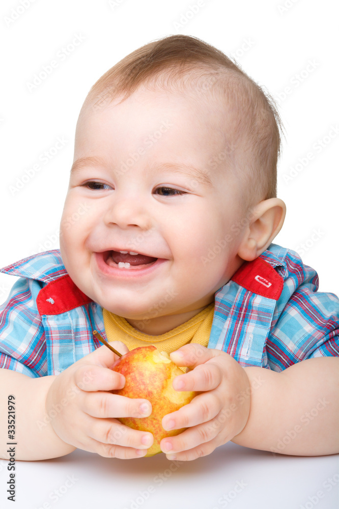 Little child is eating red apple and smile Little child is eating red apple and smile