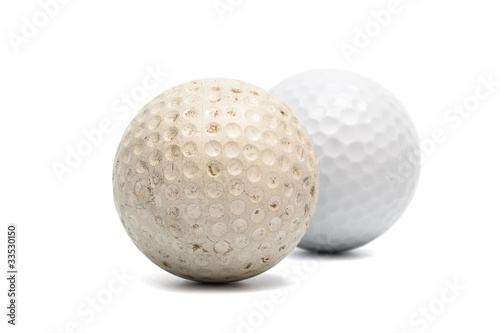 old and new golf ball