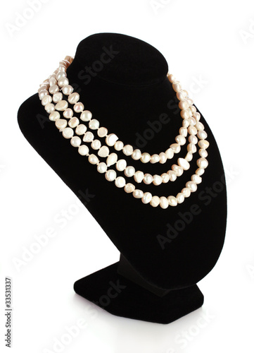 pearl necklace on a mannequin isolated on white
