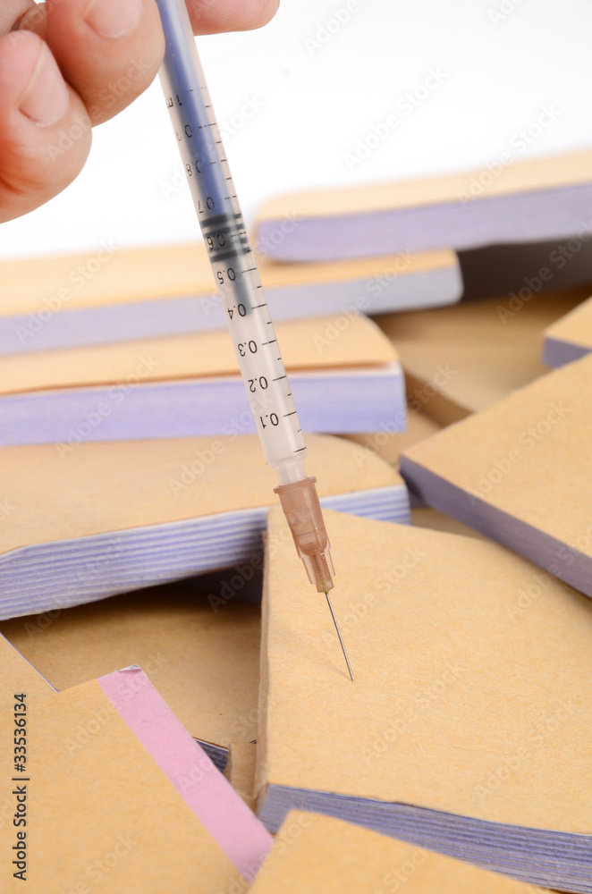 Documents and syringe