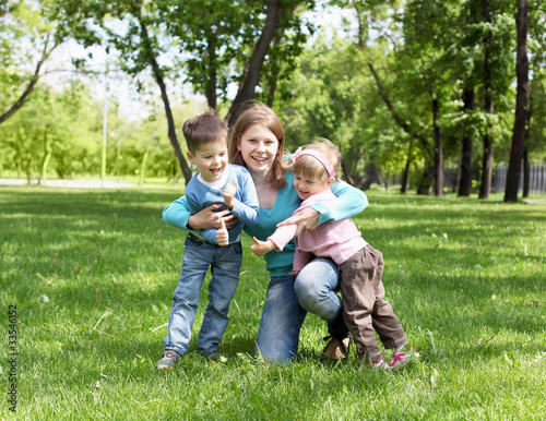 Portrait of mother and children in the park
