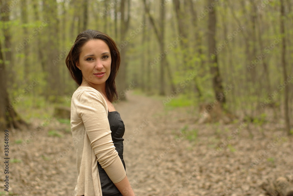 Smiling female in the spring forest Smiling female in the spring forest