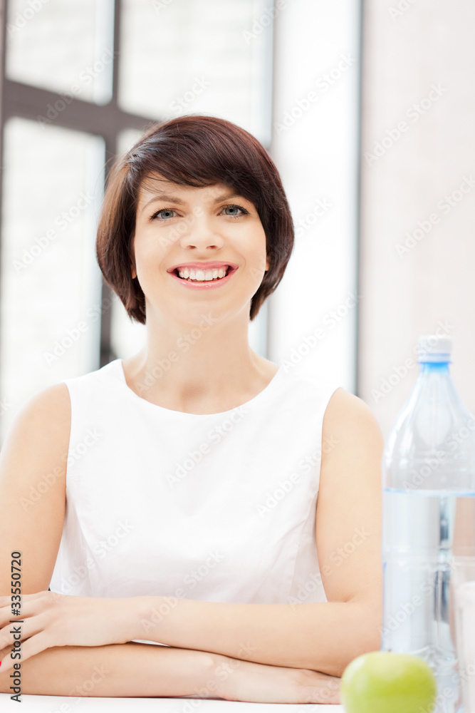 housewife with green apple and bottle of water housewife with green apple and bottle of water