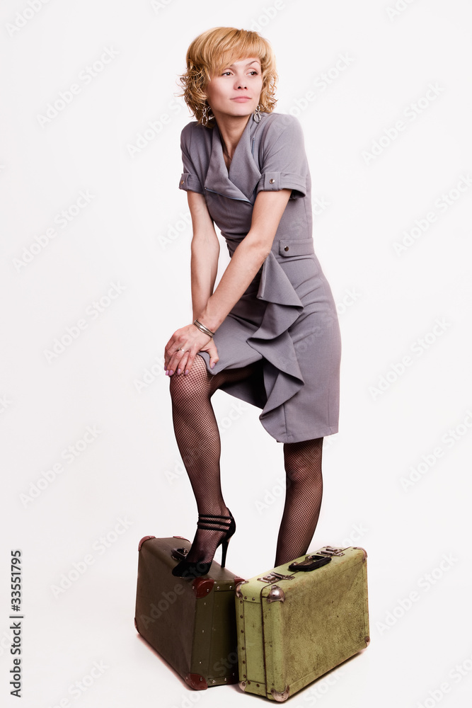 Girl in gray with baggage Girl in gray with baggage