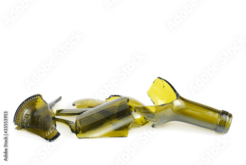 Shattered green wine bottle isolated on the white background