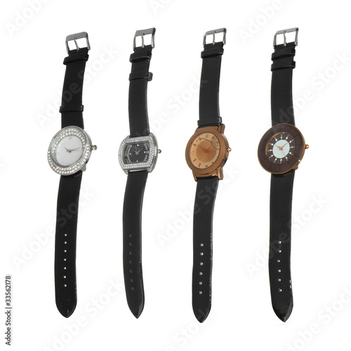 four different style watches isolated on white