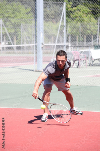 Man playing tennis © auremar
