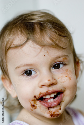 Portrait of little girl with chocolate