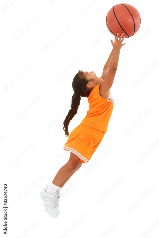 Adorable Girl Child in Uniform Jumping with Basketball