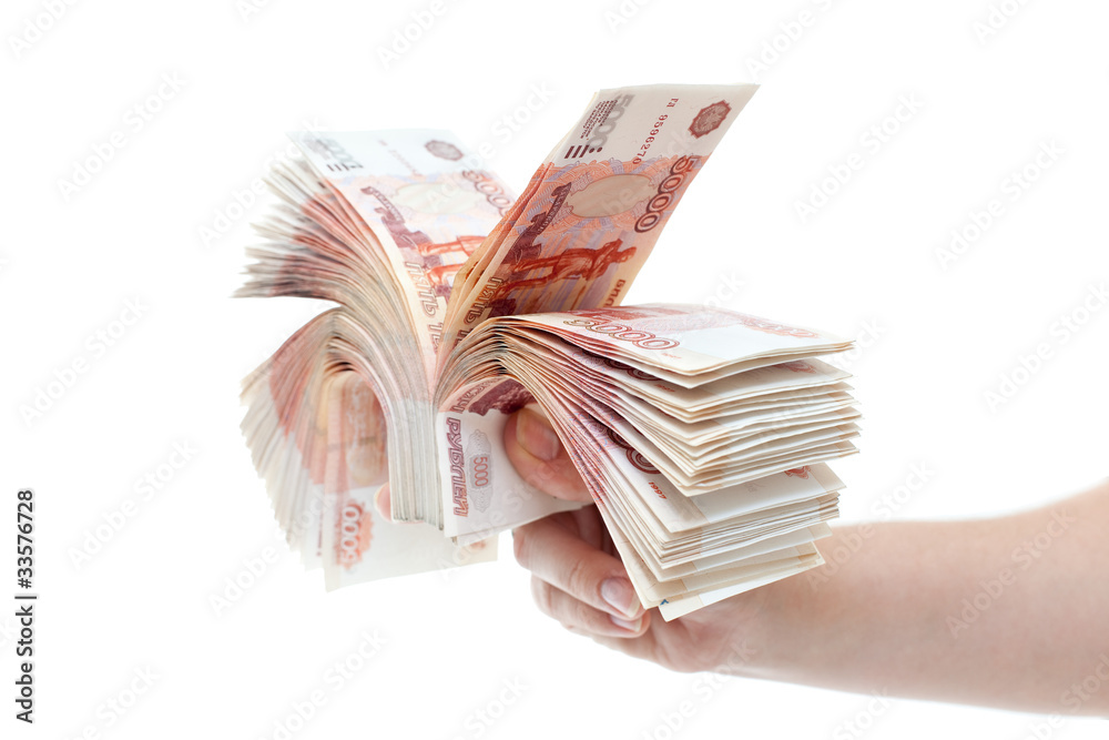 Bundle of money in hands of women isolated on white background Bundle of money in hands of women isolated on white background