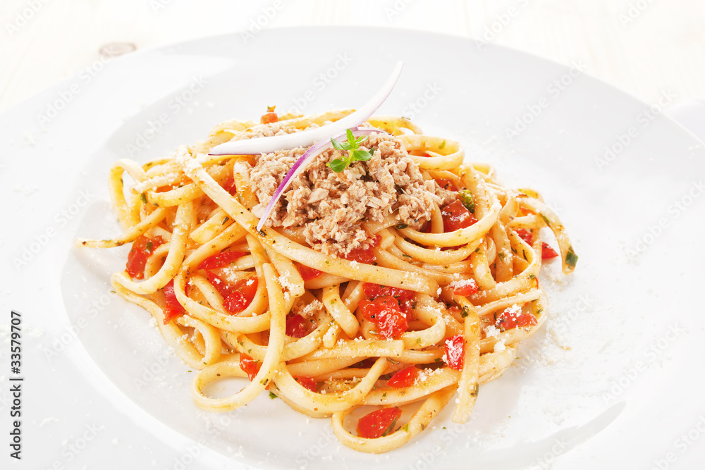 Tasty spaghetti with tomato sauce and tuna.