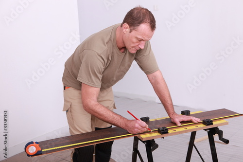 Man working on a workbench © auremar