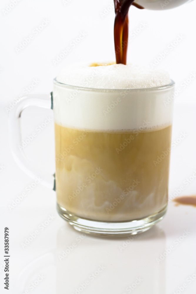 hot coffee latte in a glassy cup preparing hot coffee latte in a glassy cup preparing