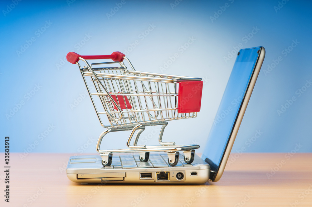 Internet online shopping concept with computer and cart Internet online shopping concept with computer and cart